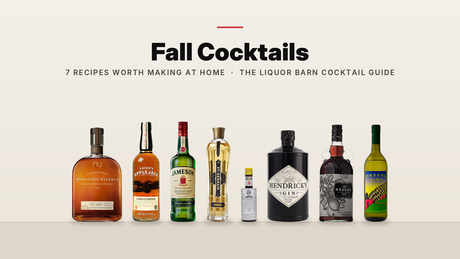 Fall cocktail bottles on a shelf: Woodford Reserve, Laird's Applejack, Jameson, St-Germain, Angostura Bitters, Hendrick's Gin, Kraken Spiced Rum and Del Maguey Vida mezcal